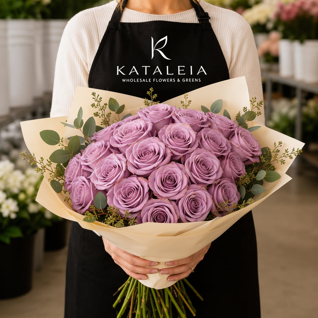 Florist holding a wholesale bouquet of fresh lavender Andrea roses with eucalyptus, farm-direct from Kataleia